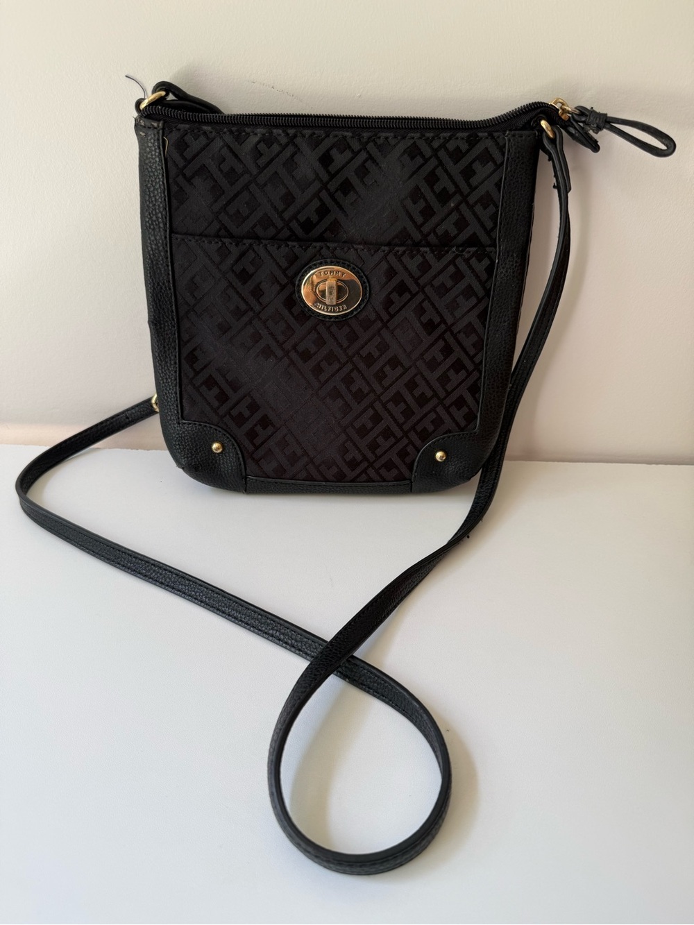 Tommy Hilfiger Black Monogram Messenger Bag with Gold Emblem